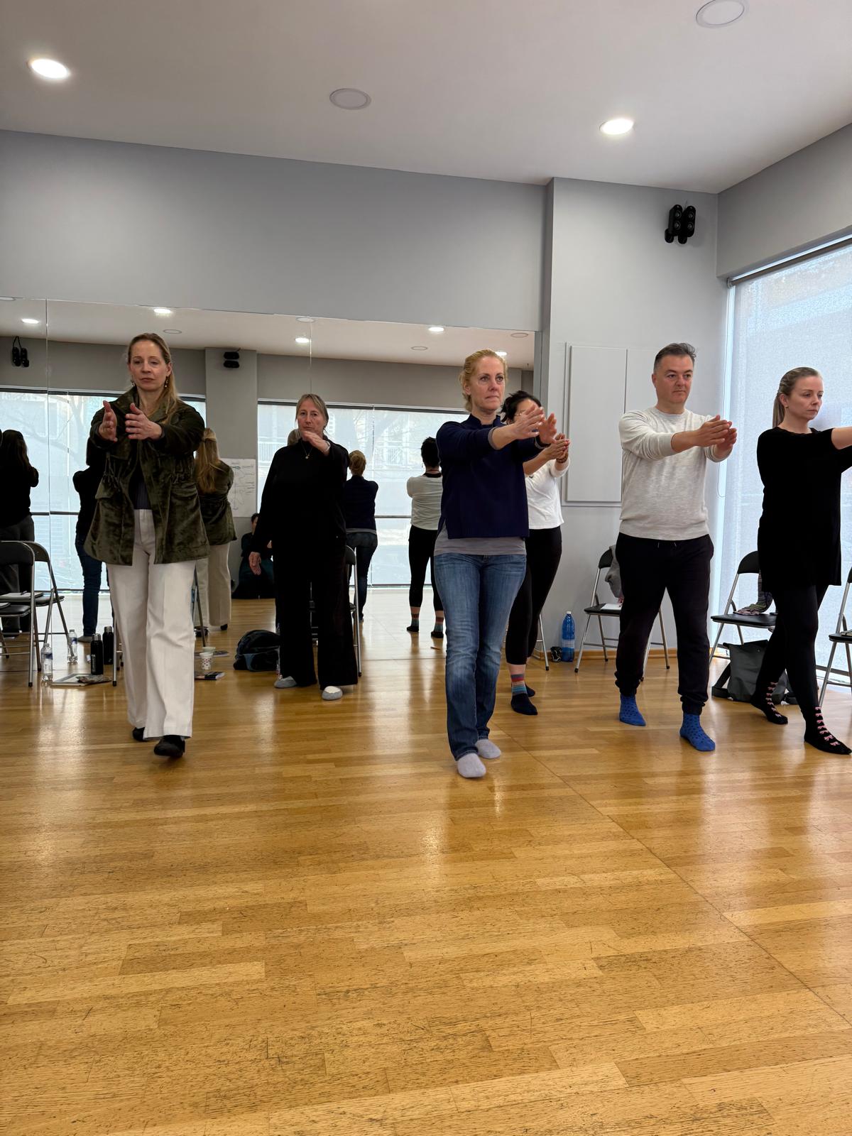 Workshop participants practising a centring exercise